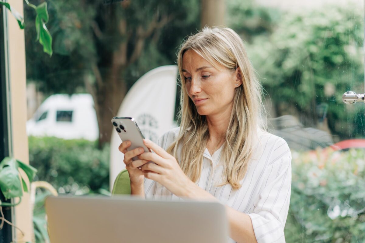 Woman working from a café